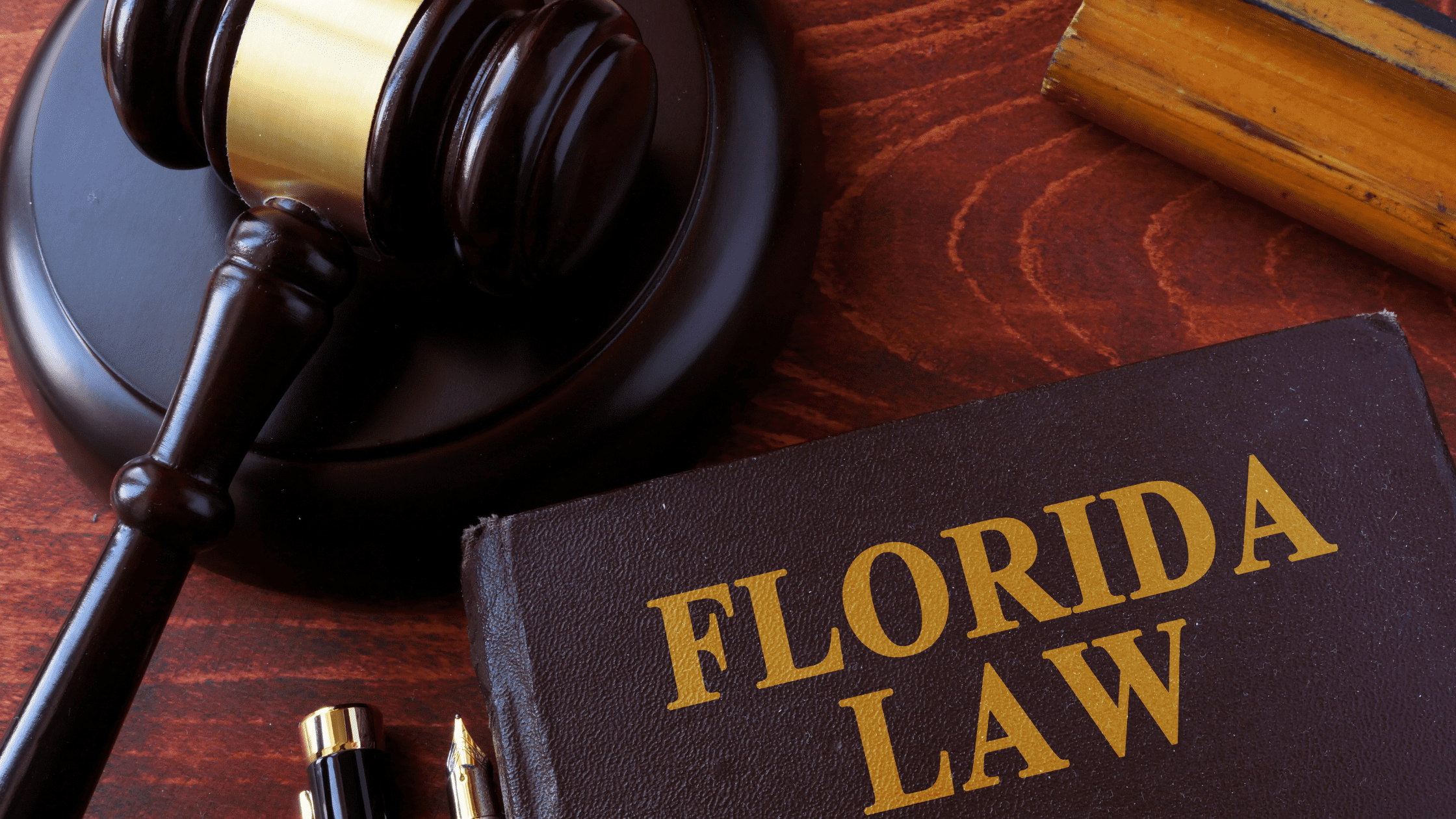 florida law book on a desk next to a gavel